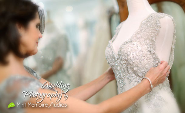 mother_of_the_bride_inspecting_dress
